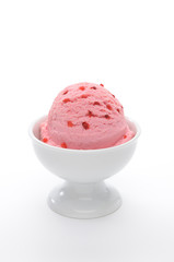 Strawberry ice cream scoop in bowl isolated on white background