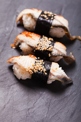 Unagi nigiri sushi set on the black slate
