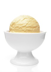Vanilla ice cream scoops in bowl isolated on white background