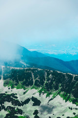 Beautiful alpine high mountains peaks, blue sky background. Amazing Mountain hiking paradise...