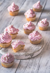 Many pink cream homemade cupcakes