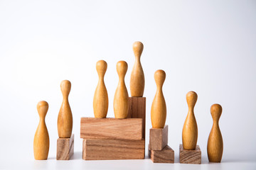 Business leadership concept. Wooden figures on blocks