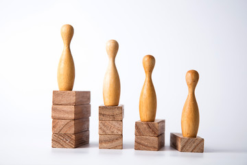 Business leadership concept. Wooden figures on blocks