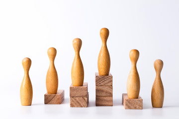 Business leadership concept. Wooden figures on blocks