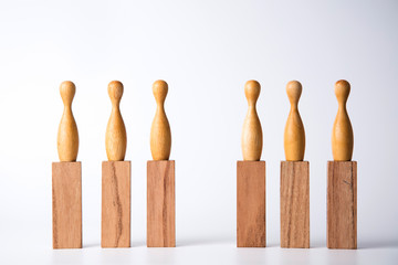 Business leadership concept. Wooden figures on blocks