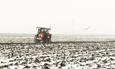 Tractor plowing a field