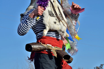 Decoration details of Moshul costume - rabbit skins,ribbons and red belt with cow bells it is traditional personage of romanian Christmas festival, symbolizes a good spirit of clan