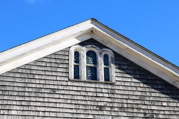 Old rustic weathered wooden barn abandoned in New England Village