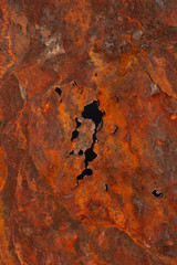 Rusty iron sheet. Fatal oxidation of metal. A dead ship destroyed by the sea.