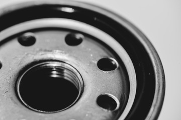 Monochrome background image of oil filter close up. Artwork from auto part in macro photography in grayscale.
