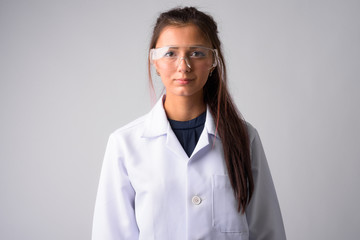 Young beautiful woman doctor with protective glasses