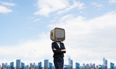 Business woman with old TV instead of head.