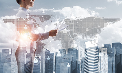 Concept of business success and control with confident boss against cityscape background