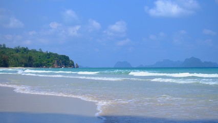 A beautiful sea beach with water waves and a horizontal line,blue sky in bright day