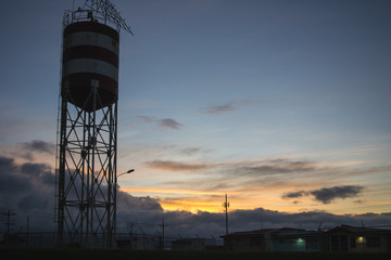 sunset next to the water tank
