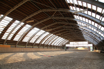 Empty riding hall  building interior without people ready for equestrian training wintertime