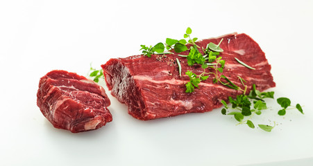 Medallion sliced off a whole raw beef fillet © exclusive-design