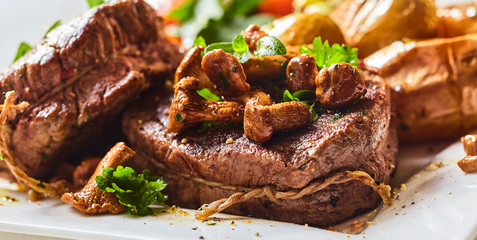 Tender thick rare roasted beef fillet medallions