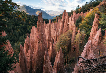 Earth pyramids with stones on top in Renon Ritten region, South Tyrol, Italy. - 242648524