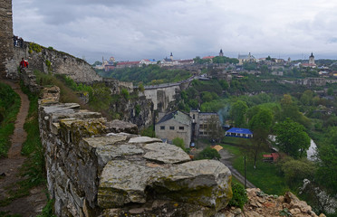 Fototapeta na wymiar Ukraine, Kamyanets-Podilsky fortress in the rain on May 2, 2015
