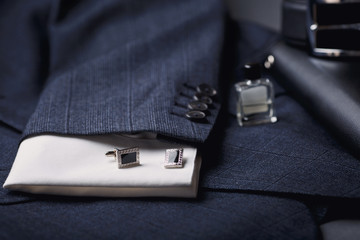 Men's accessories - cufflinks, shirt, pen, jacket.