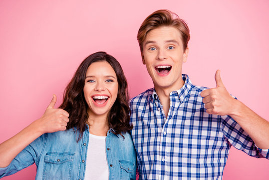 Close up portrait of two hugging young she her he him his glad s