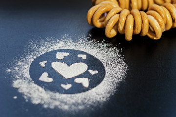 Concept Of Valentine's Day. Picture of heart of flour on a black background. Happy Valentines Day background.