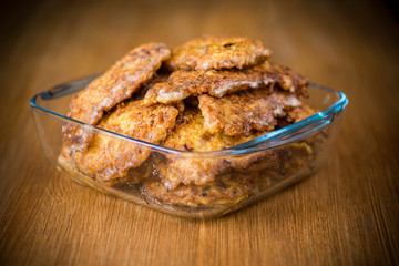 pork fillet chop fried in batter, in a plate
