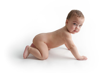 Naked baby sitting on the floor