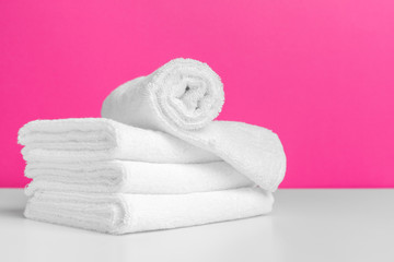 Obraz na płótnie Canvas Clean towels on color background