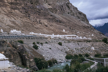 Rows of white stupa situated along side at the Shyok river at Hunder, Leh.