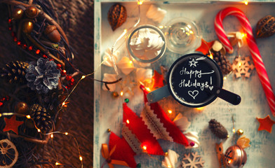 happy winter holidays background/a cup of coffee  ,marshmallows and decorations on the tray