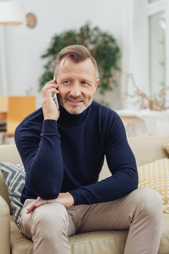 Middle-aged man listening to a phone call