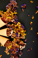 Bouquet Flowers in a waffle cone on a black background.