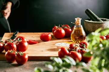 Tomatoes, basil and oil for Italian cuisine