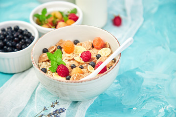 Healthy vegetarian breakfast. Oatmeal, granola with raspberries