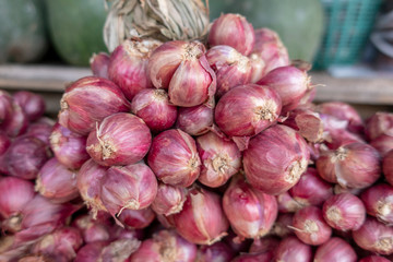 Red onions are cultivars of the onion (Allium cepa) with purplish-red skin and white flesh tinged with red.  These onions tend to be medium to large in size and have a mild to sweet 