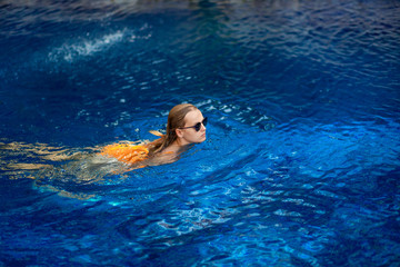 Girl swimming in the pool