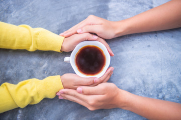 A cup of tea in the hands. Selective focus. Drink