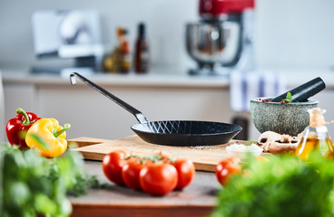 Skillet or pan with a stone pestle and mortar