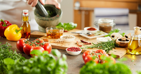 Panorama of the hands of a chef preparing herbs