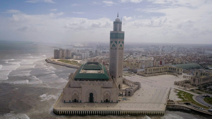 The Hassan II Mosque or Grande Mosquée Hassan II is a mosque in Casablanca, Morocco. It is the largest mosque in Africa, and the 5th largest in the world. - obrazy, fototapety, plakaty