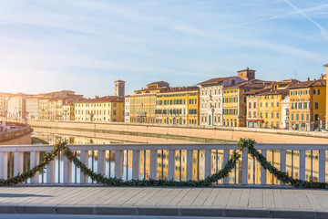 View on embankment and bridge of Arno river Pisa, Italy.