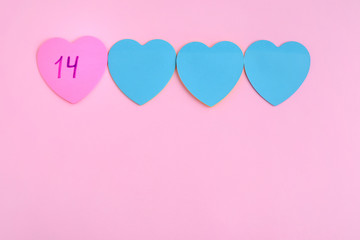 Fototapeta na wymiar Pink and blue paper hearts. 14 february pink background with beautiful heart. Love valentines day card with hearts. happy valentines day romantic card. holiday decorative heart with selective focus