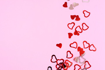 14 february abstract background with red and silver hearts. Love valentines day card with heart. happy valentines day romantic card. Shiny hearts on pink background. frame with holiday hearts. 
