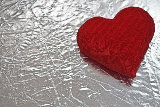 Valentine's day red heart on a silver background