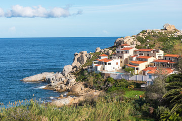 Fototapeta na wymiar Houses on the rocky coast of Corsica, France