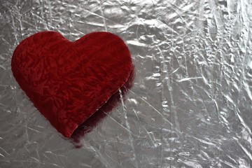 Valentine's day red heart on a silver background