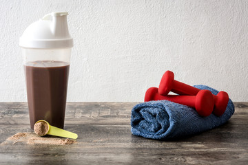 Chocolate protein shake on wooden table