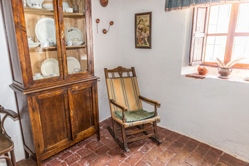 Vintage style furniture in a room of an old house, Spain